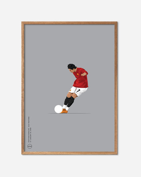 Fodbold plakat med spiller i Manchester United trøje, sparkende til bold, egetræsramme