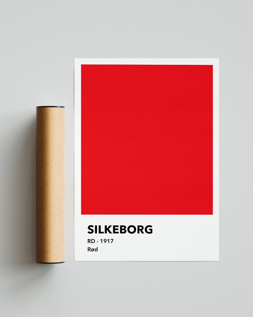 En Silkeborg I.F. fodbold plakat med deres røde farve fra Colors kollektionen ved siden af emballage - Olé Olé